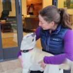 Dr. Jordyn Sthay and an adoring pup.