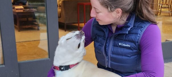 Dr. Jordyn Sthay and an adoring pup.