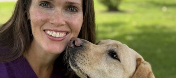 Photo of Katie Holmes, DVM and her dog Parsley.